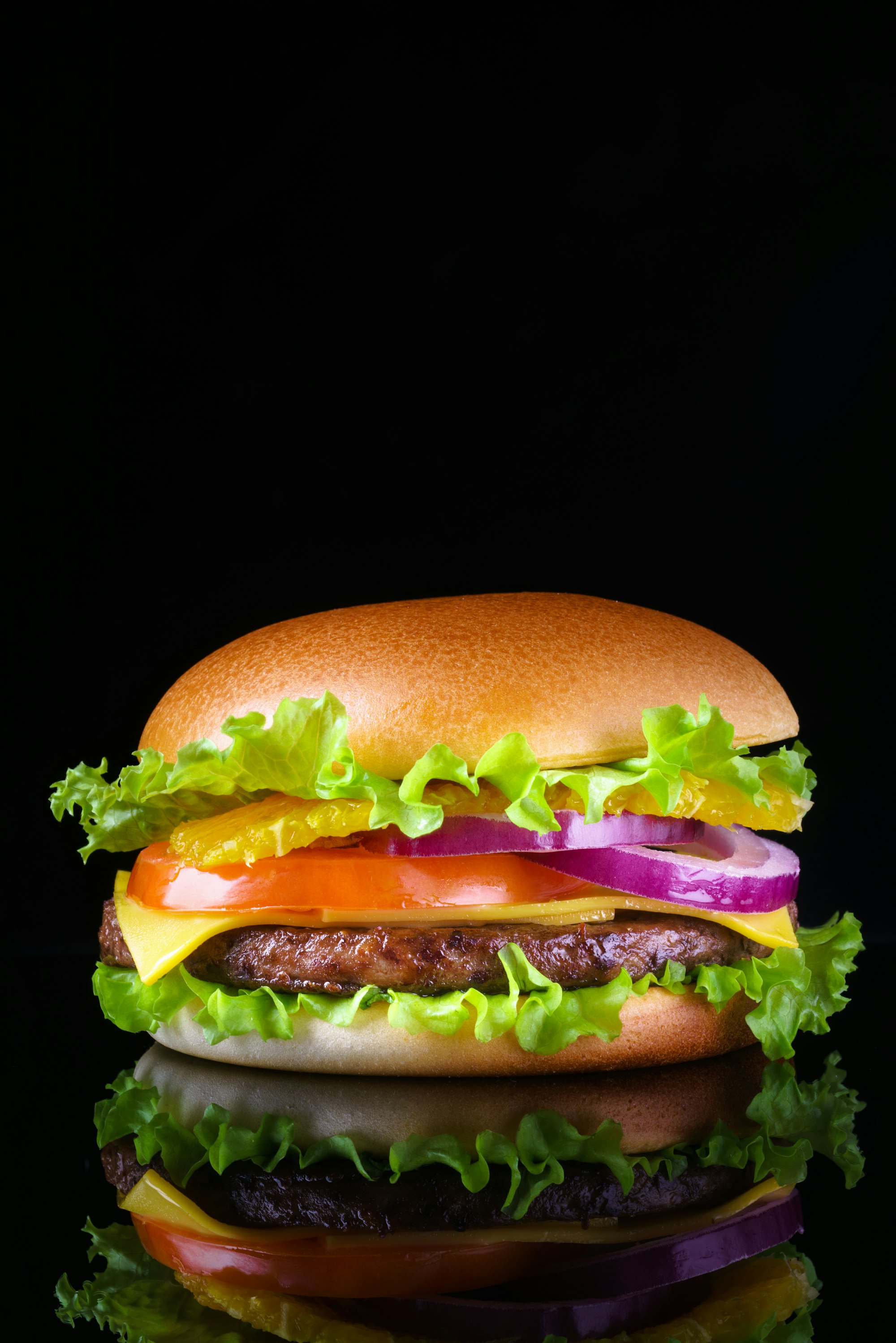 A dramatic stacked burger